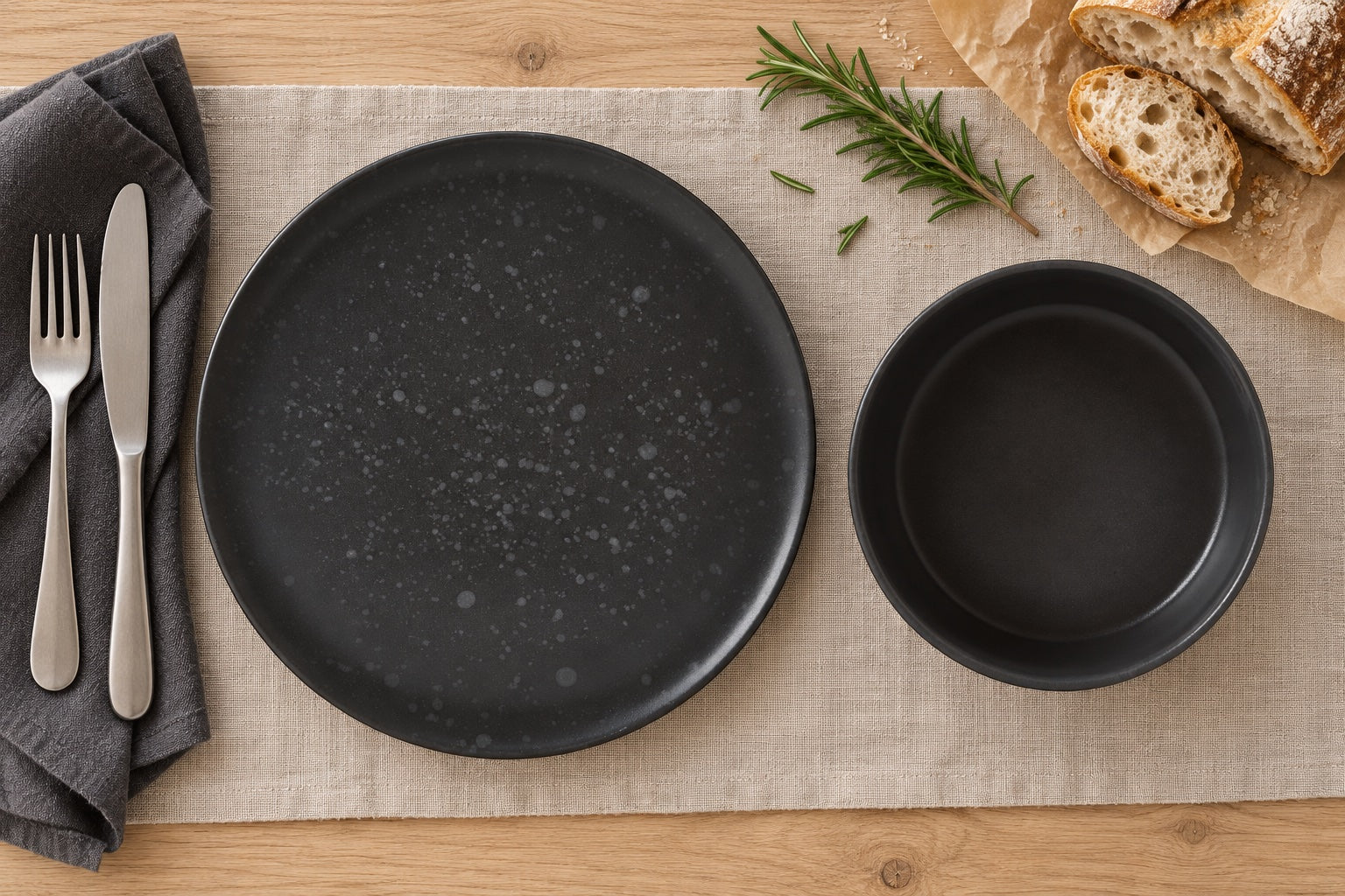 The Quiet Grey Table: Hygge Grey Speckled Dinner Plate, Hygge Medium Grey Bowl in a styled setting
