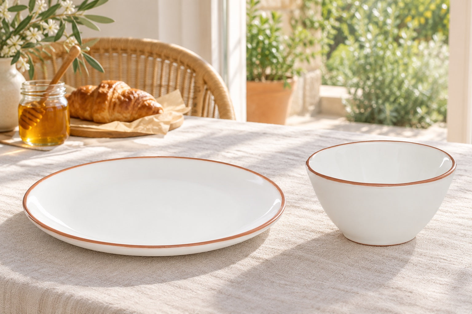 Sunlit Terracotta: Calisto Terracotta White Glazed Dinner Plate, Calisto Terracotta White Glazed Cereal Bowl in a styled setting