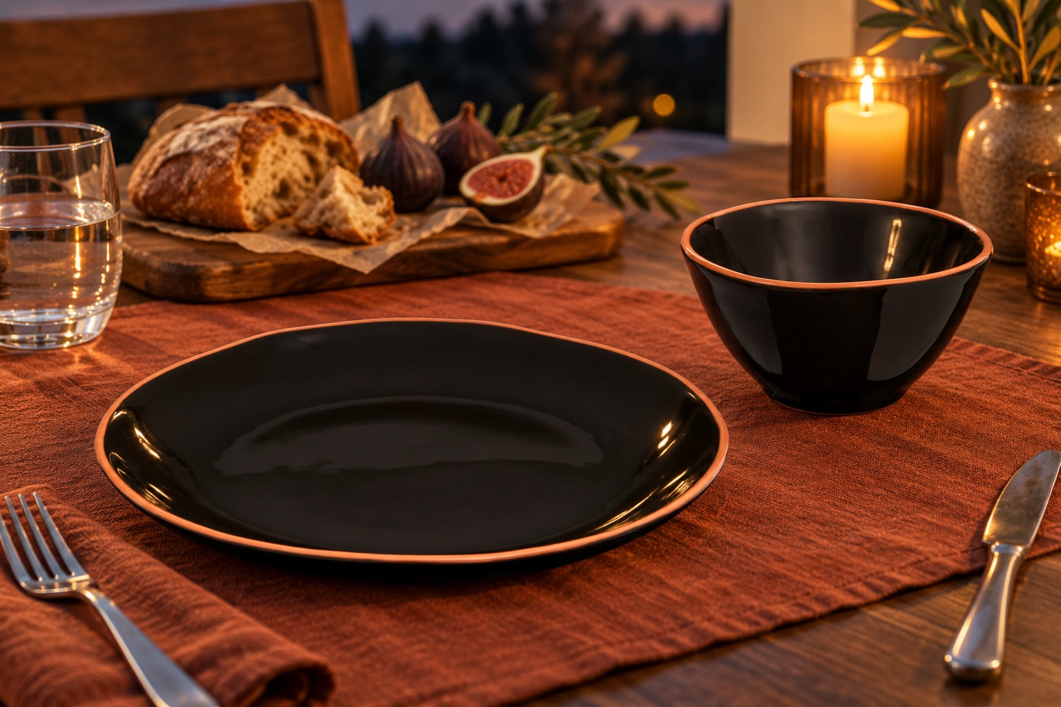Terracotta Evenings: Calisto Black Glazed Terracotta Dinner Plate, Calisto Black Glazed Terracotta Cereal Bowl in a styled setting
